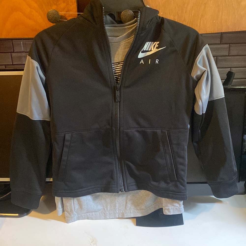 Size 6 , Nike Jacket , paired with a size 6 Under Armor Shirt.